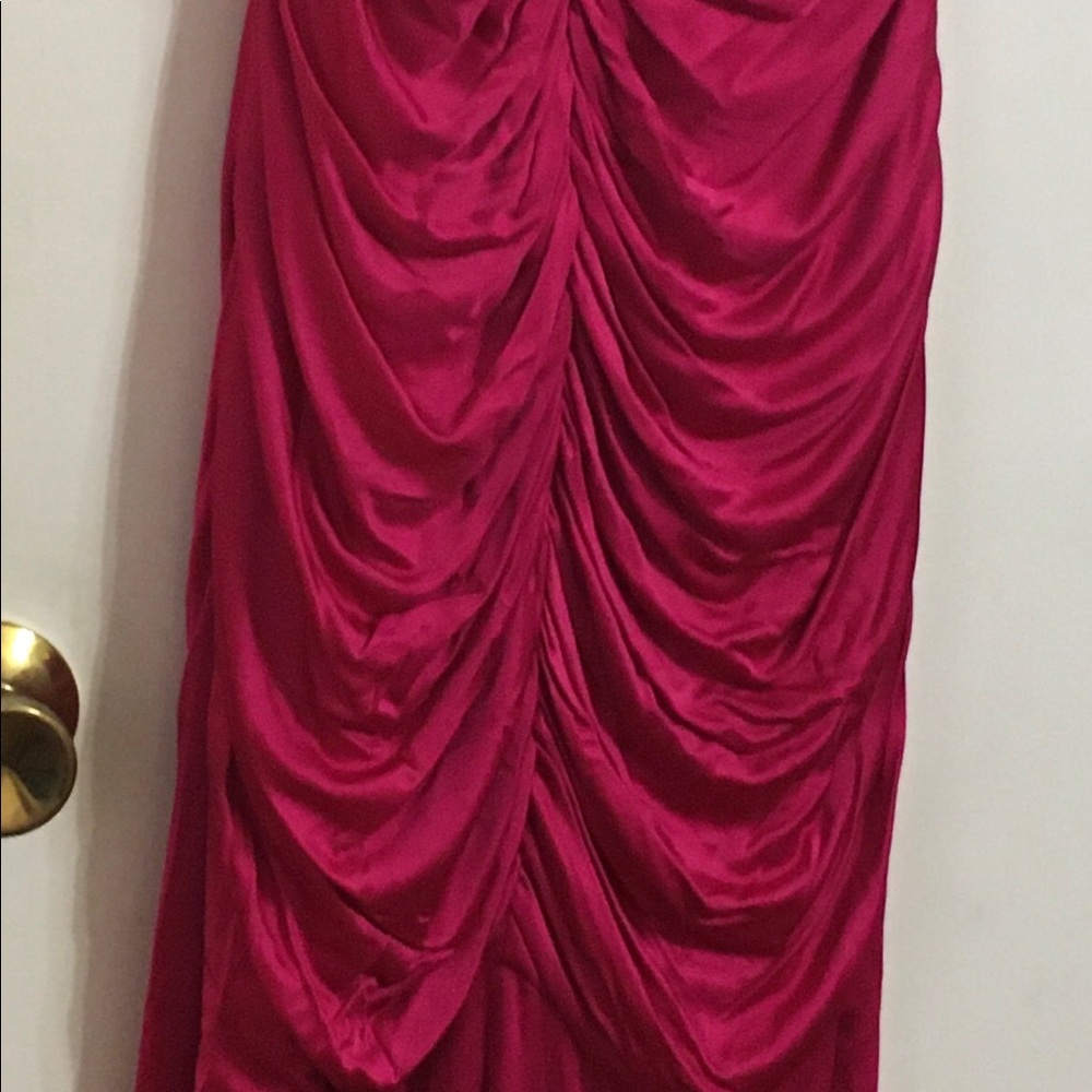 A floor length fushia evening dress